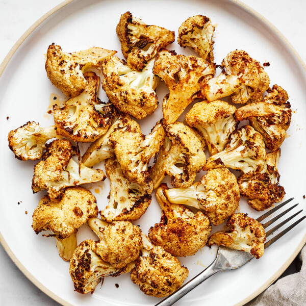 A white plate of air fryer cauliflower