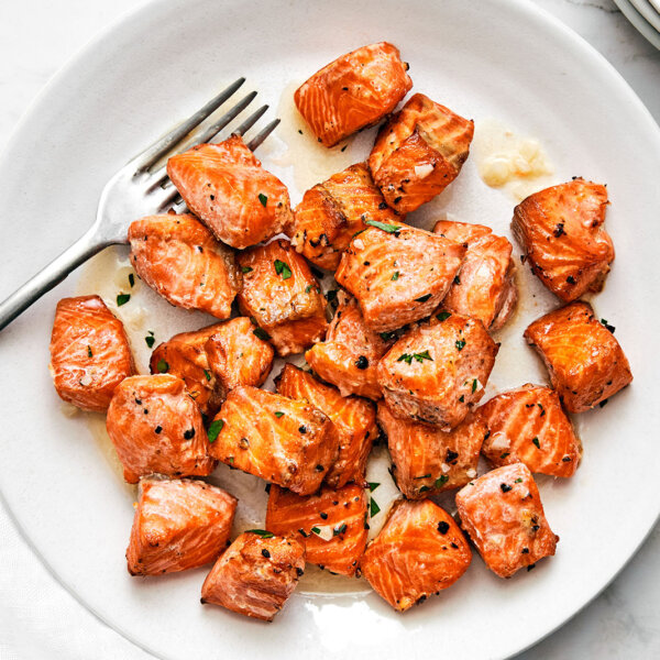 A white plate of air fryer salmon bites