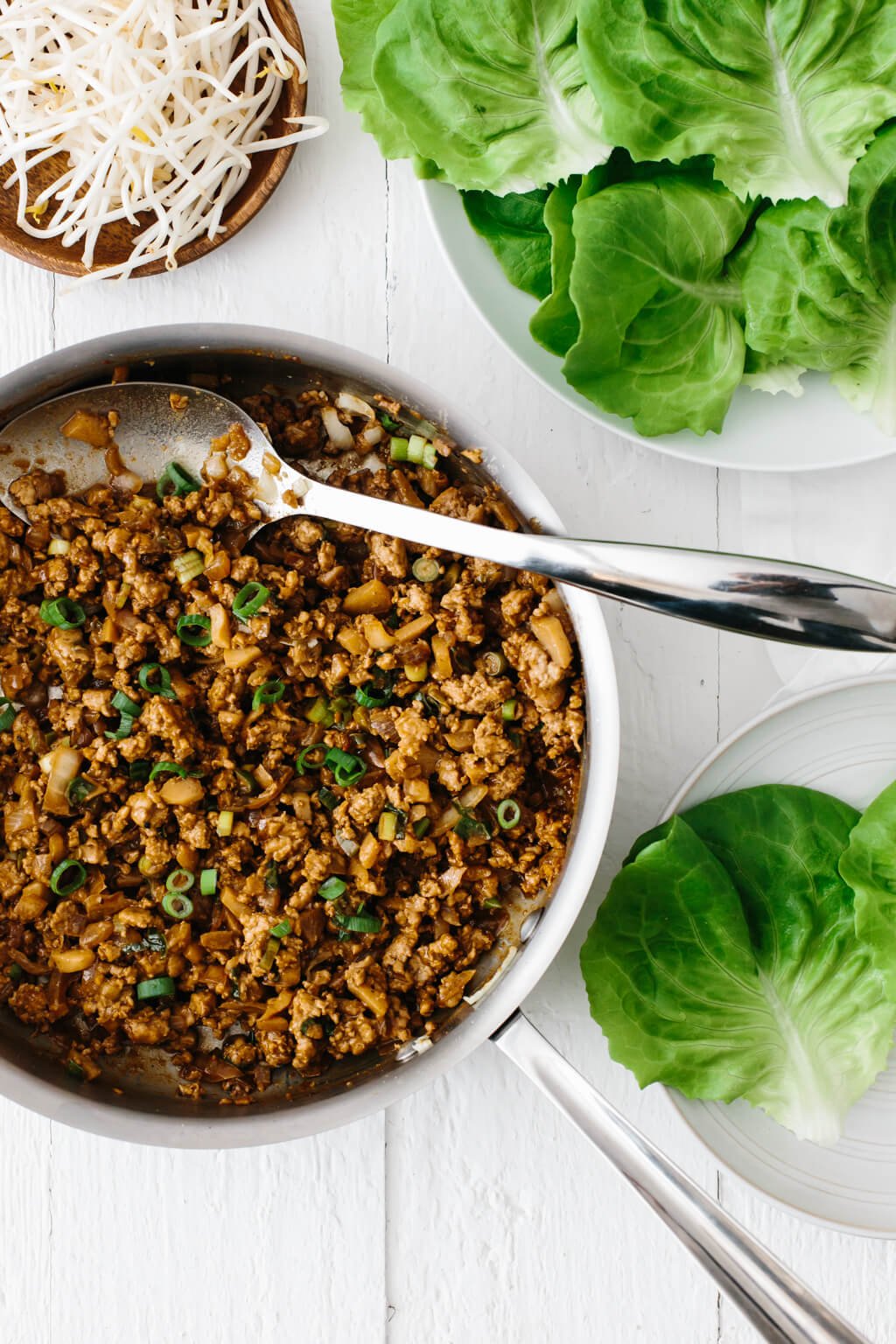 These Asian Chicken Lettuce Wraps are reminiscent of PF Chang's Chicken Lettuce Wraps, yet they're gluten-free, paleo and much healthier. It's a family favorite chicken dinner recipe.