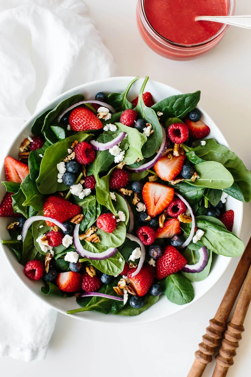 Berry spinach salad in a large bowl.