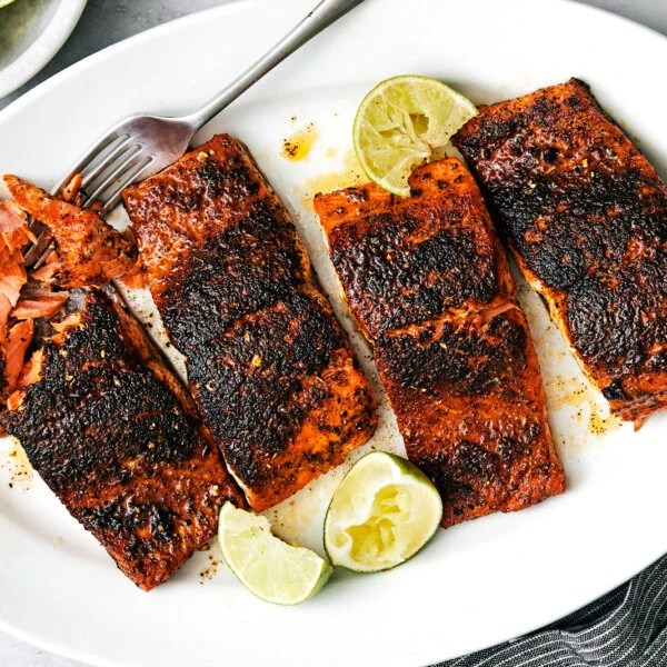 Blackened salmon on a white plate.