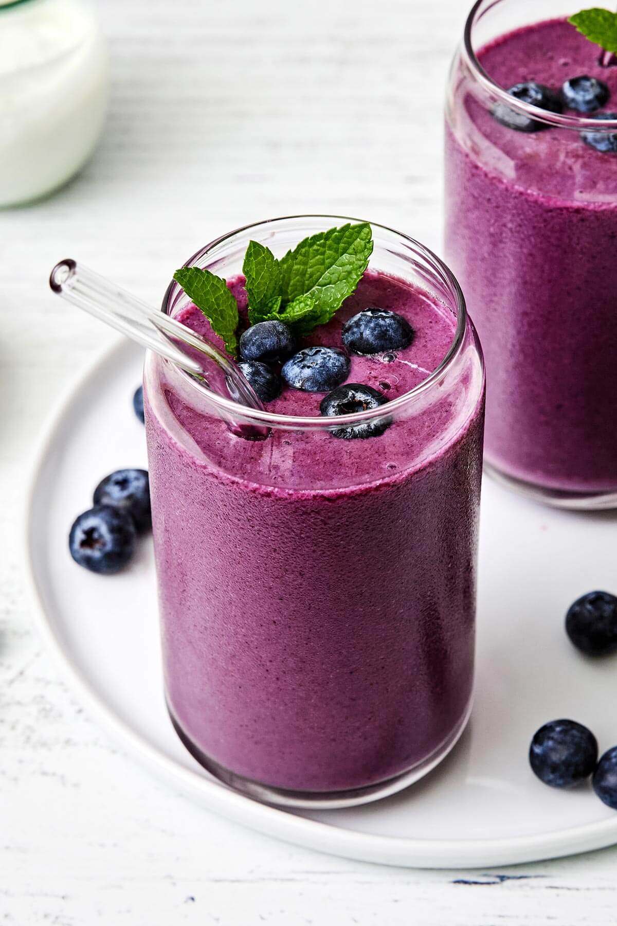 A glass of blueberry smoothie.