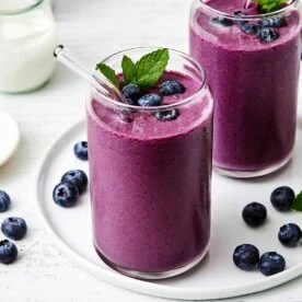 Glasses of blueberry smoothie.