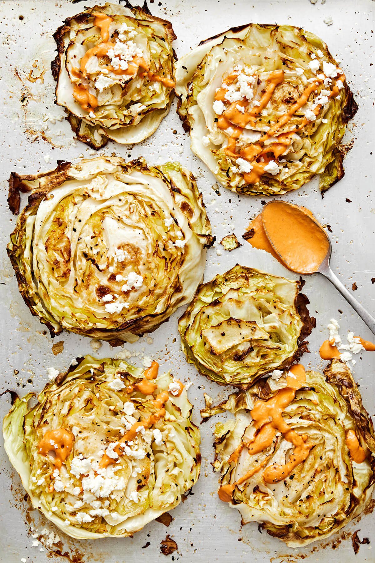 Cabbage steaks with red pepper tahini sauce