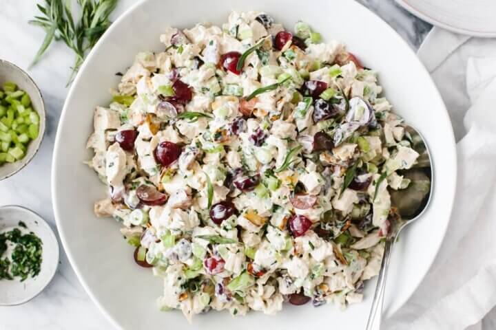 Chicken salad in a white bowl.