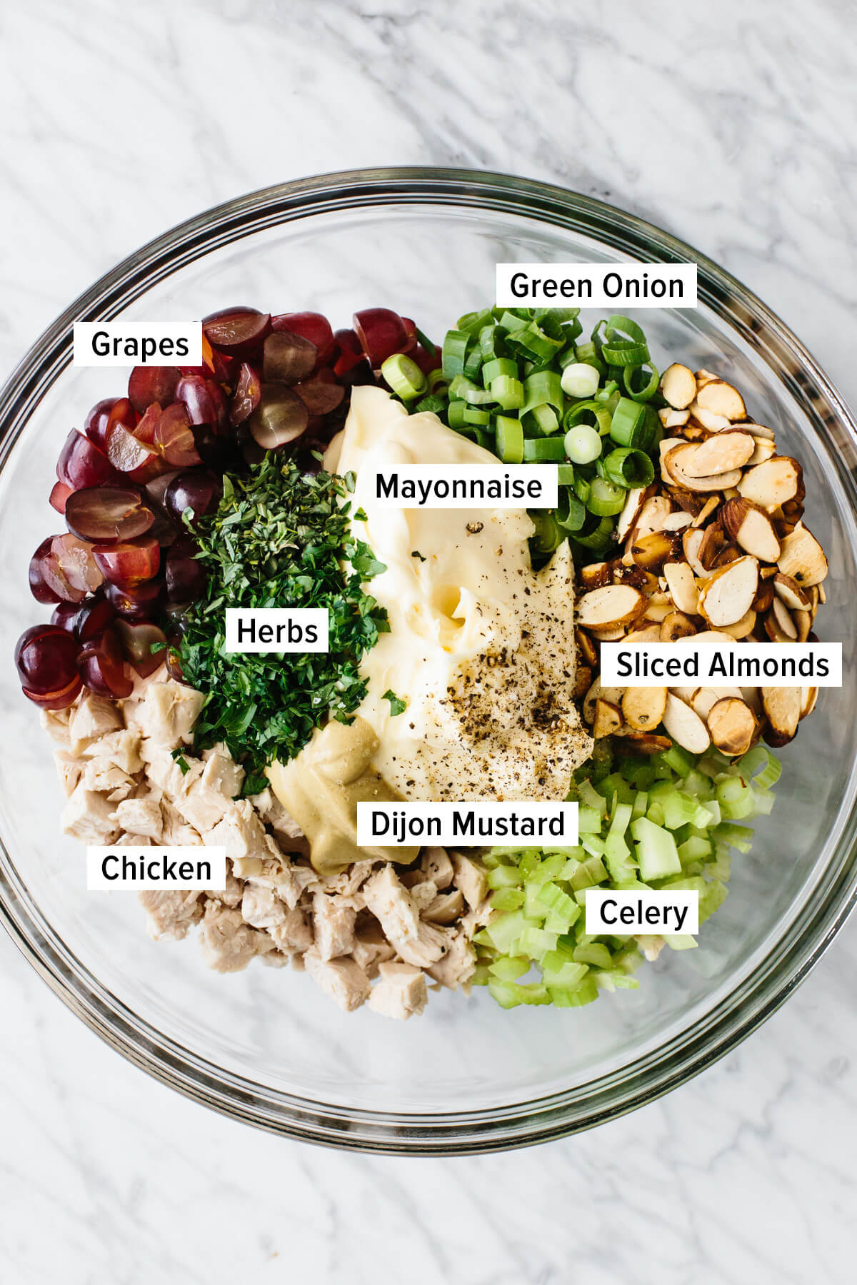 Chicken salad ingredients in a mixing bowl.