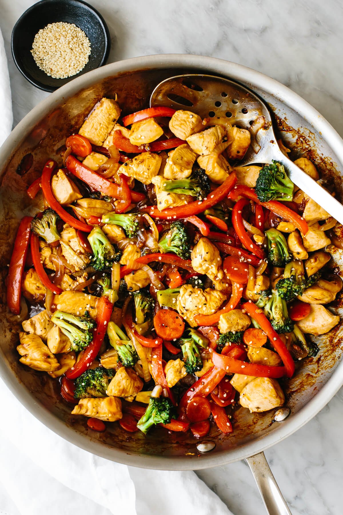 Chicken stir-fry in a pan.