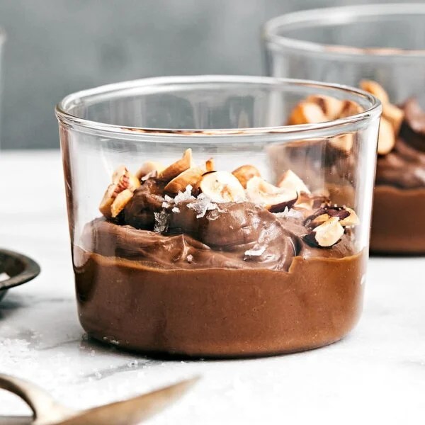 Glass cups of chocolate avocado pudding.