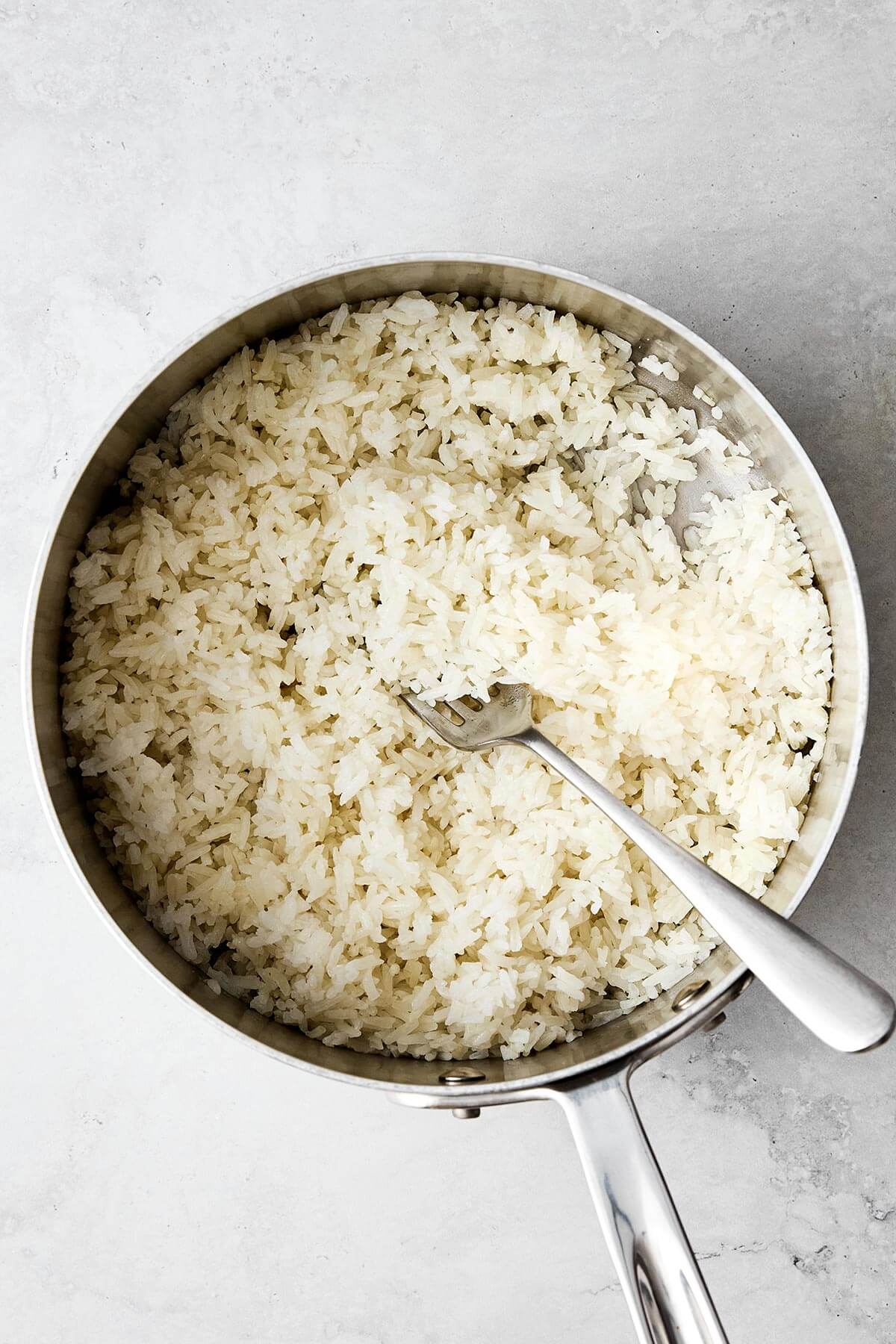 Cooked white rice in a pot.