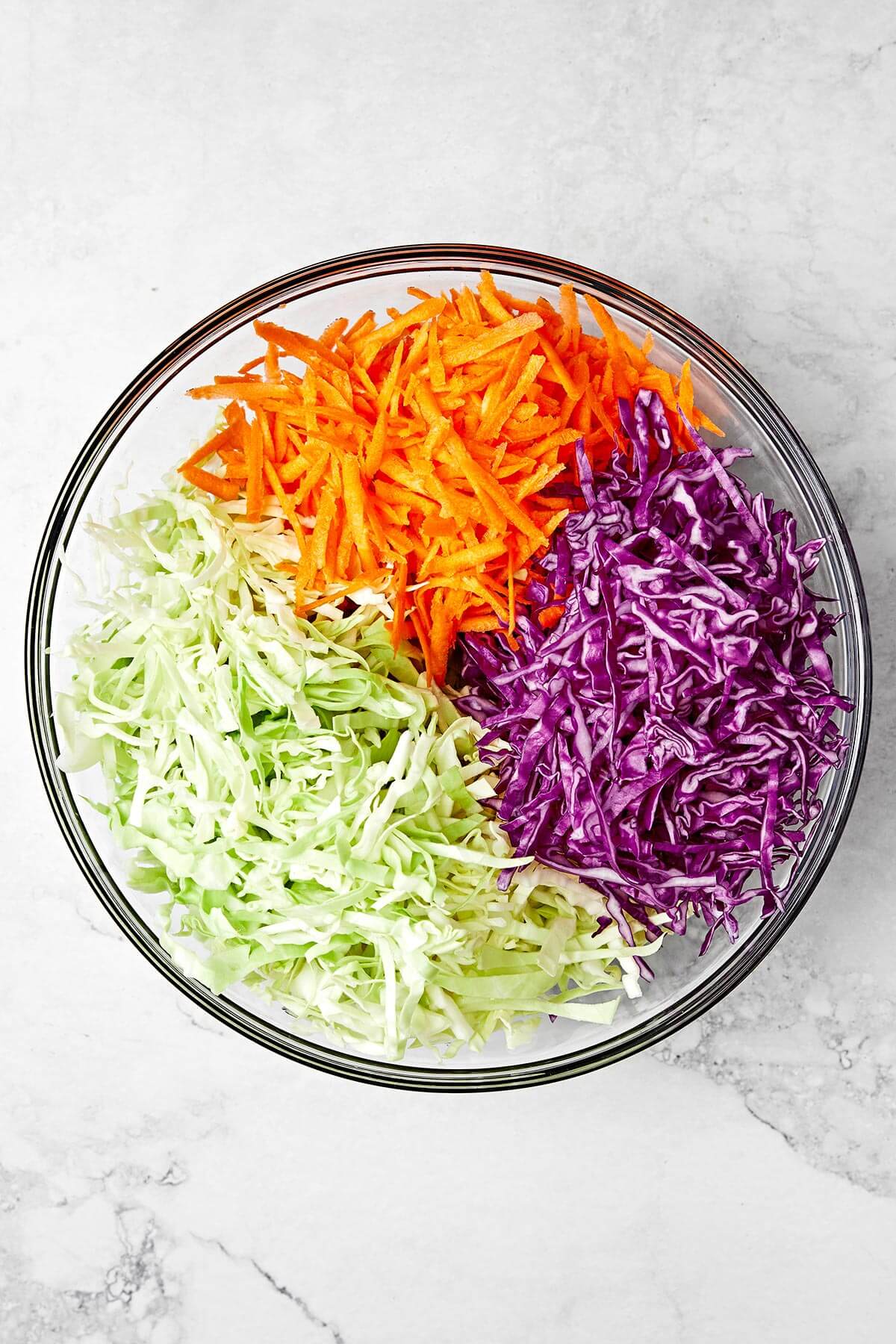 Shredded coleslaw ingredients in a bowl.