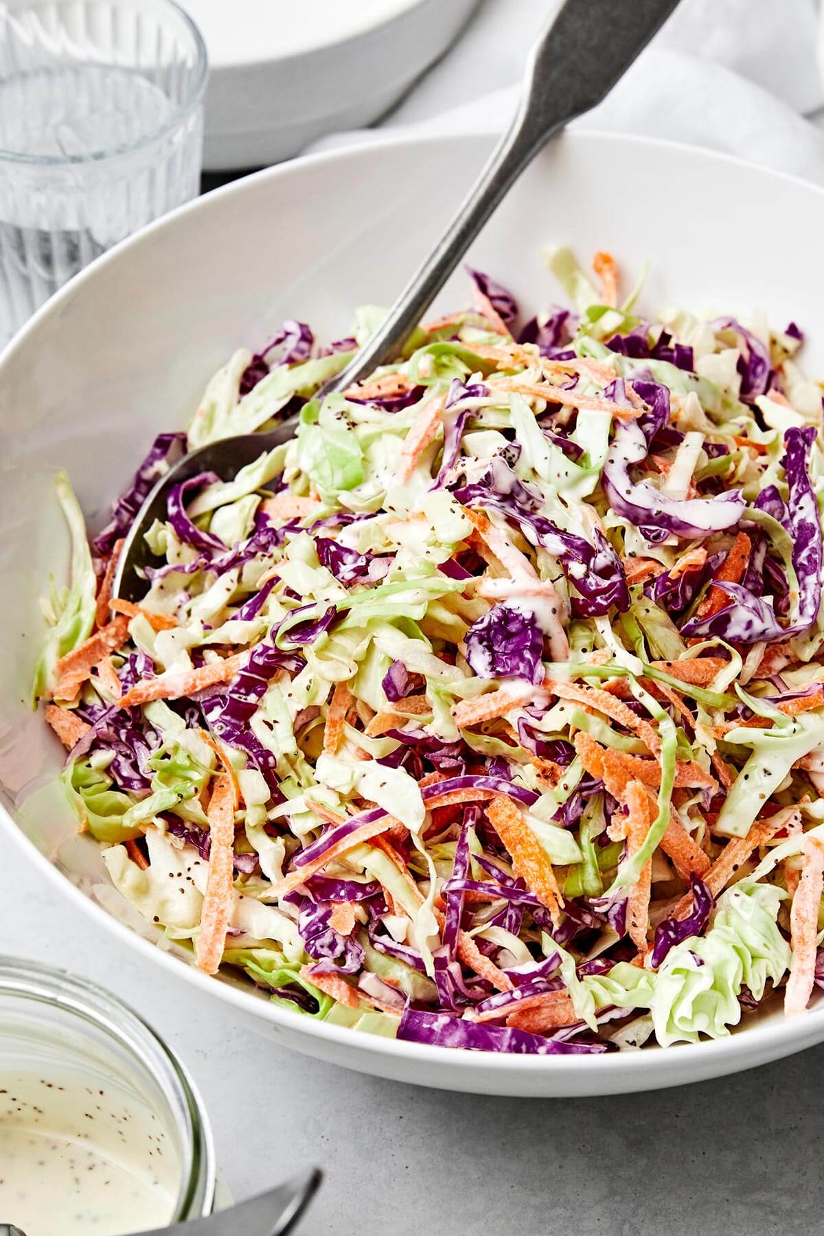 A white bowl of coleslaw.