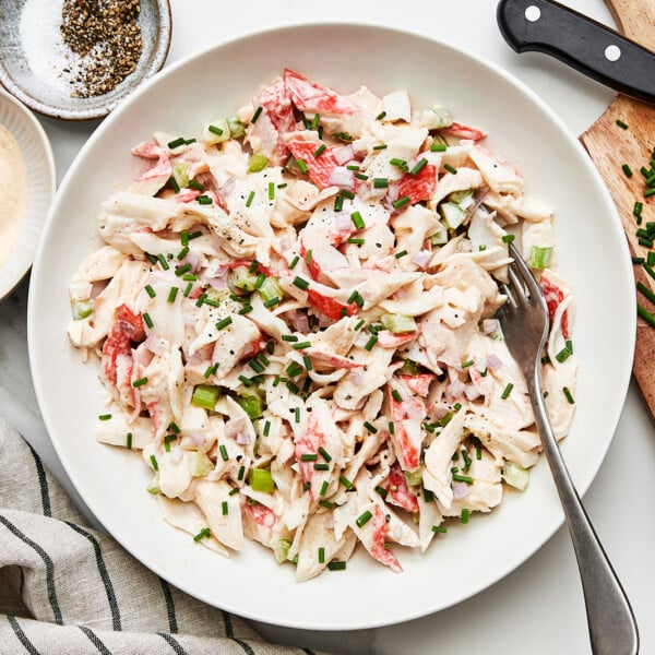 Crab salad in a bowl with a spoon