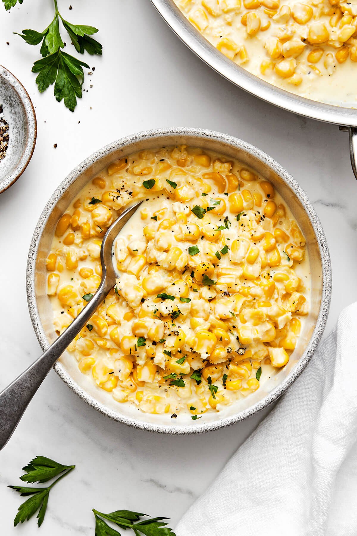 A bowl of creamed corn.