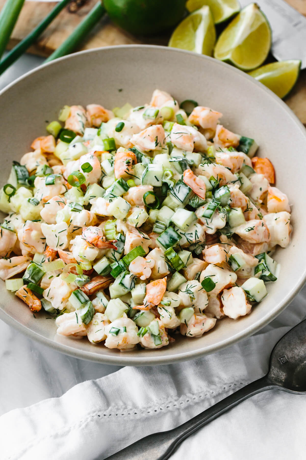 A large bowl of cucumber shrimp salad