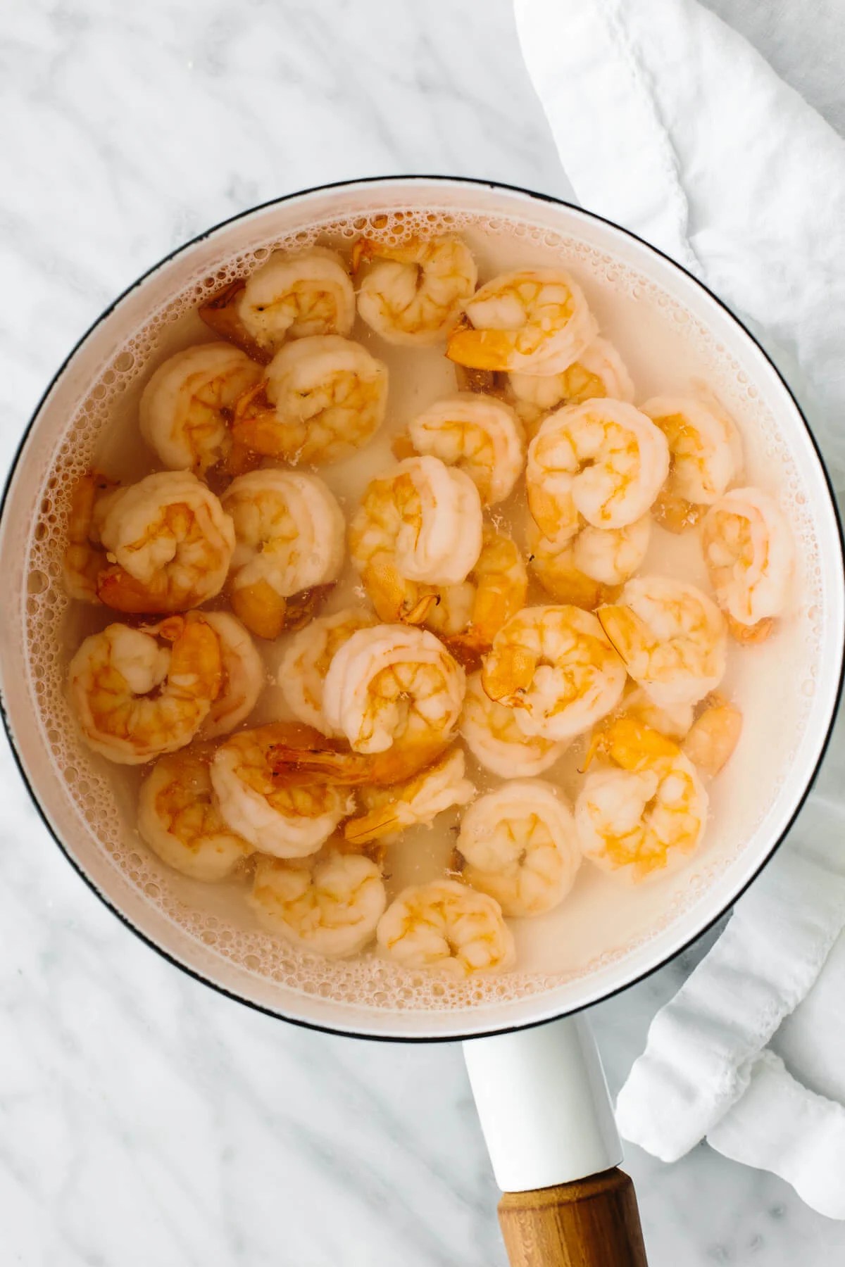 Boiling shrimp in a pot for cucumber shrimp salad