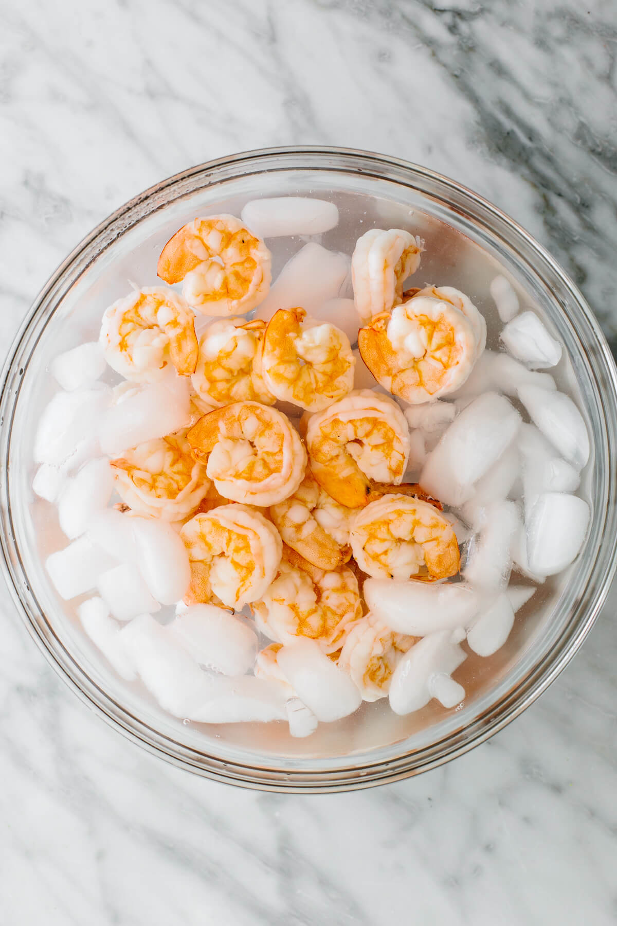 Chilling shrimp in a bowl for cucumber shrimp salad