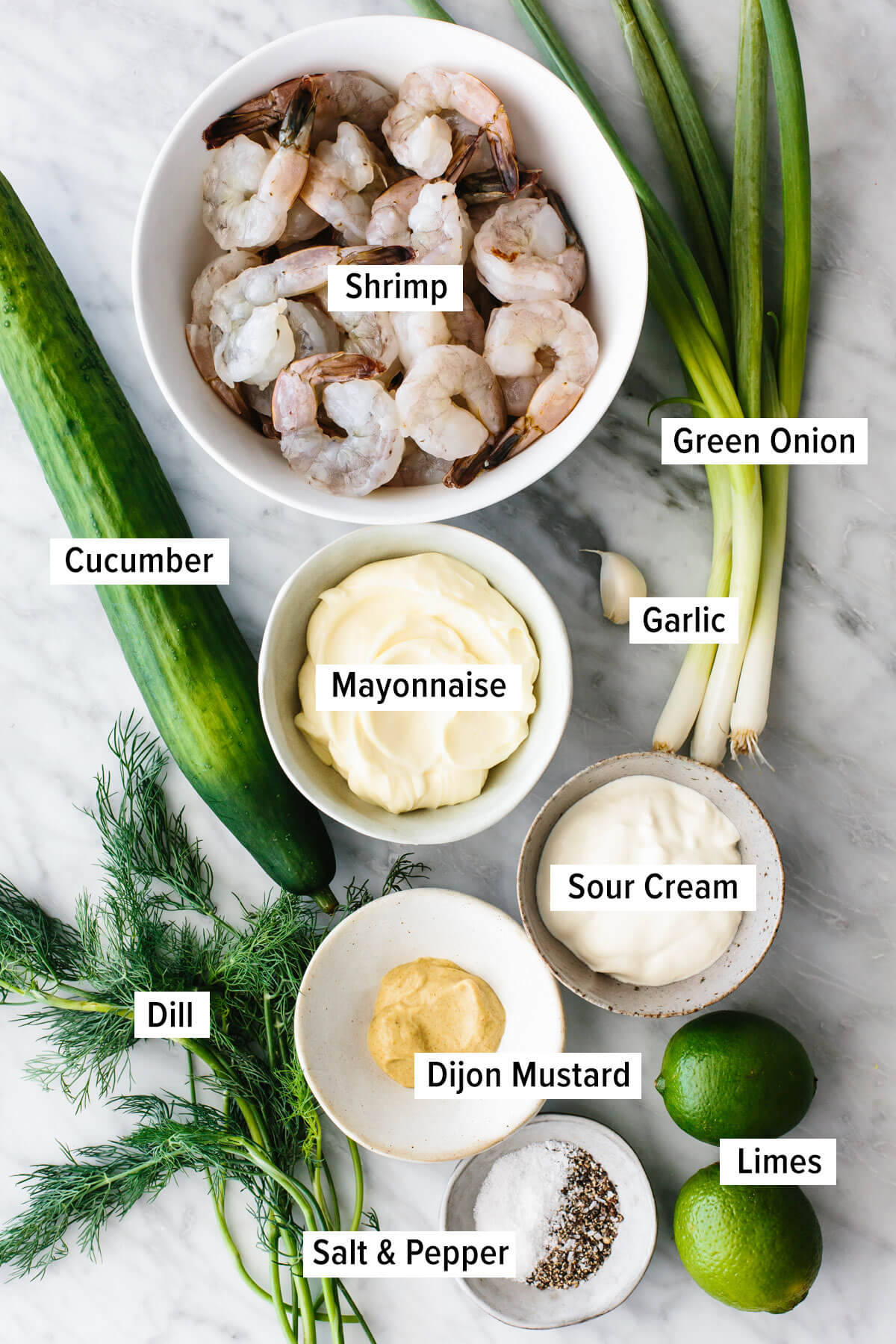 Ingredients for cucumber shrimp salad on a table