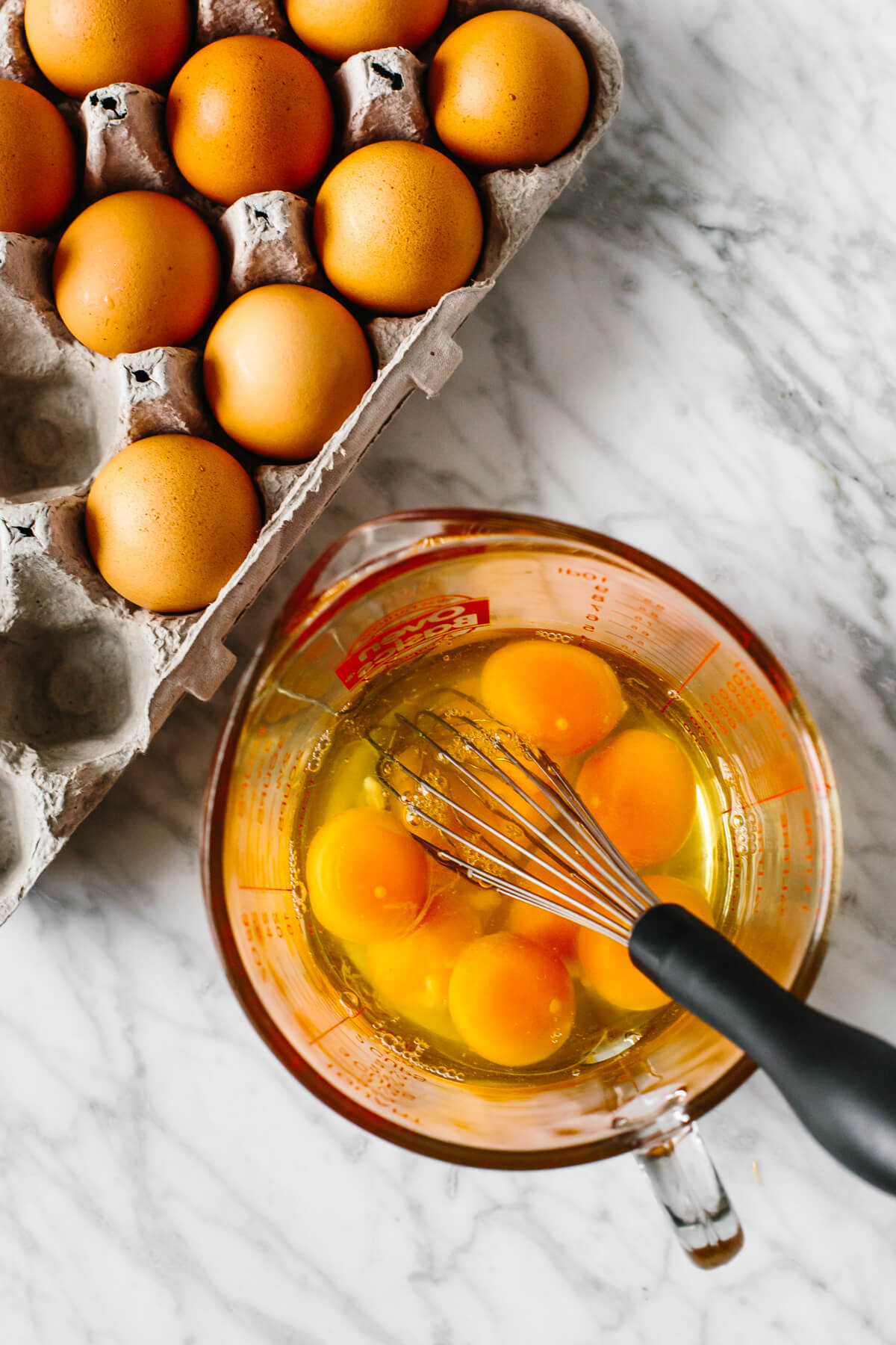 Whisking eggs in a bowl.