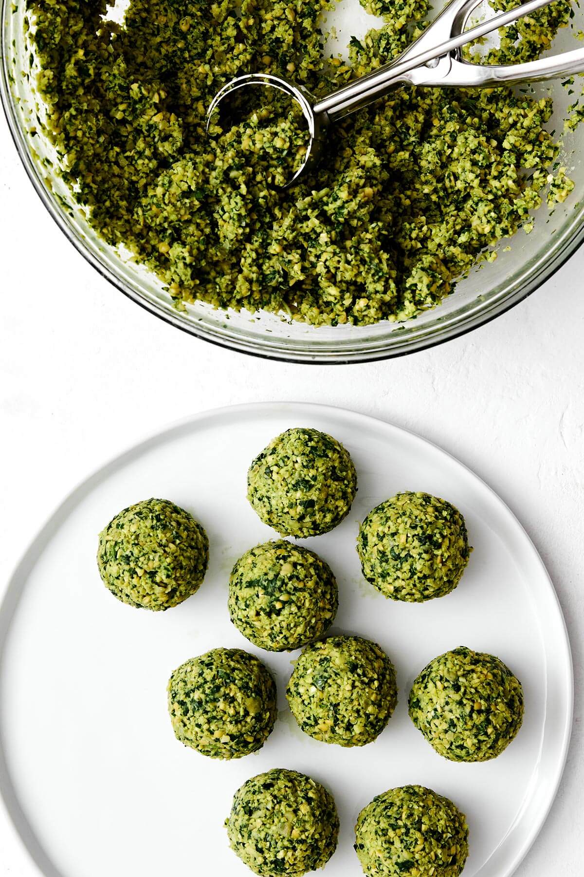 Forming falafel balls with a cookie scoop.