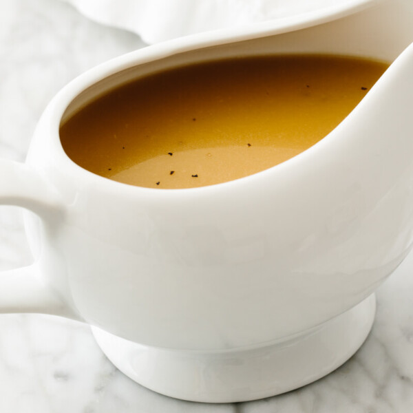 Gluten-free turkey gravy in a white gravy boat.