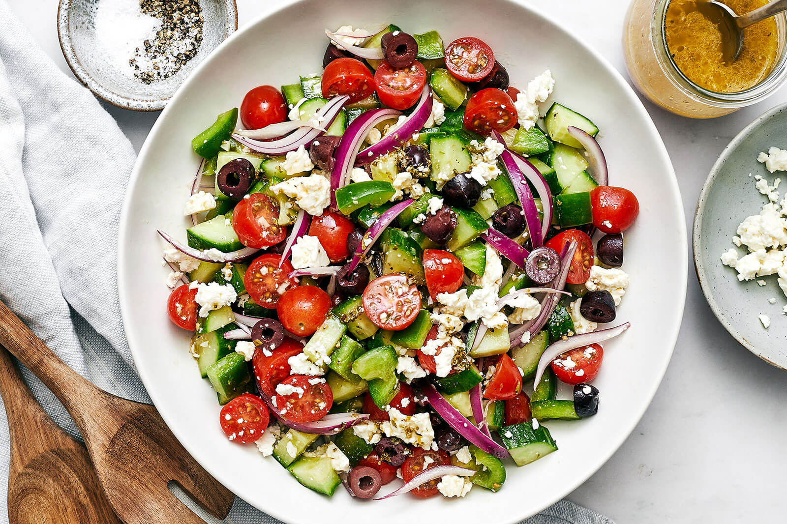 A white bowl of Greek salad