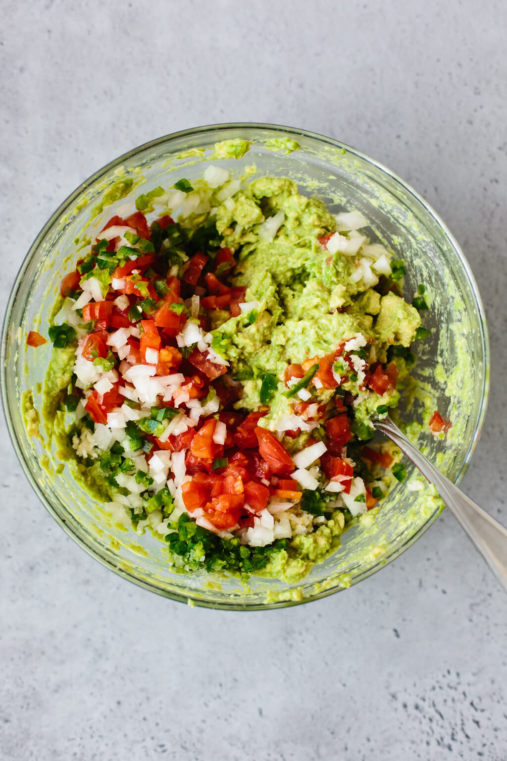 Guacamole recipe ingredients in a bowl ready to be mixed.