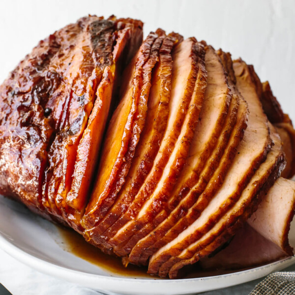 Sliced honey baked ham on a white plate