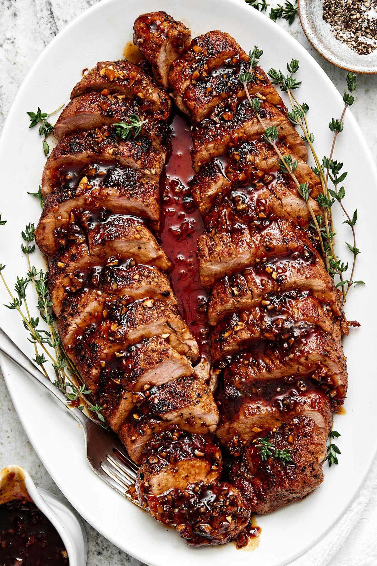 Honey garlic pork tenderloin on a plate.