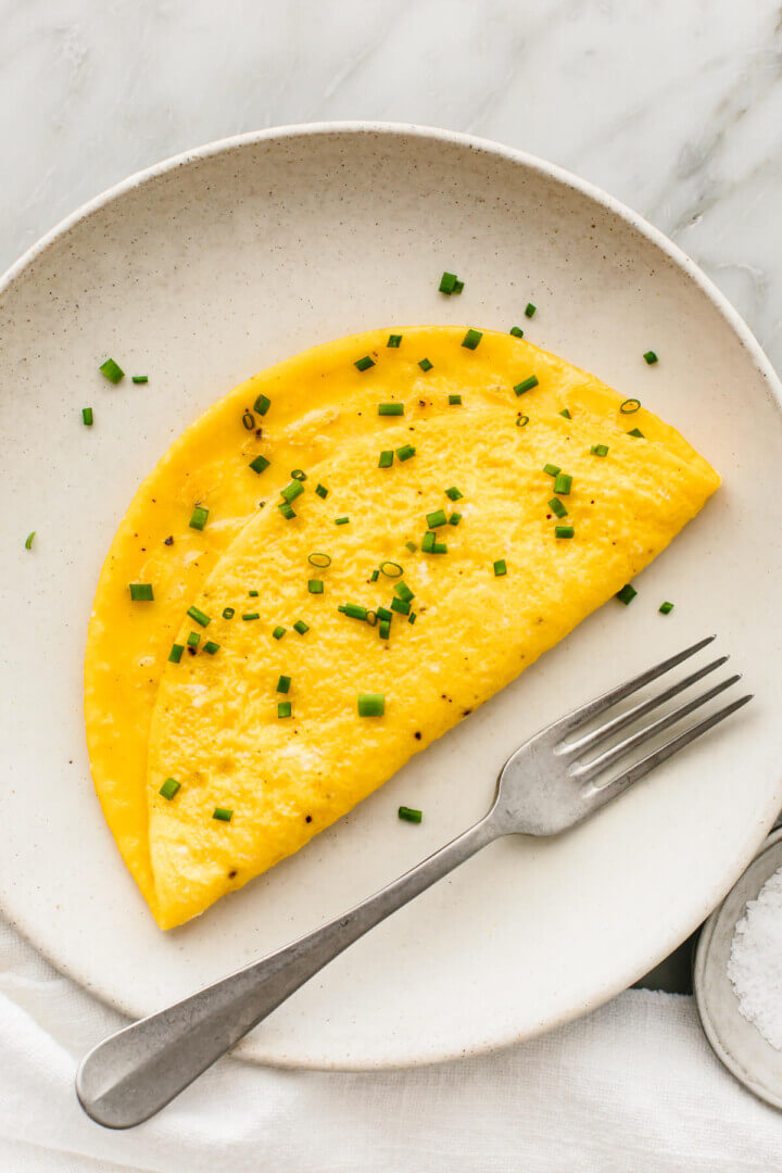 A plate with an omelette and a fork