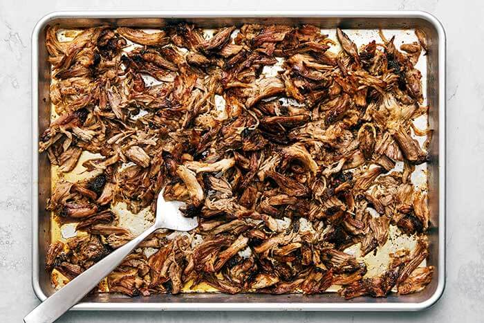 Crispy carnitas on a sheet pan.