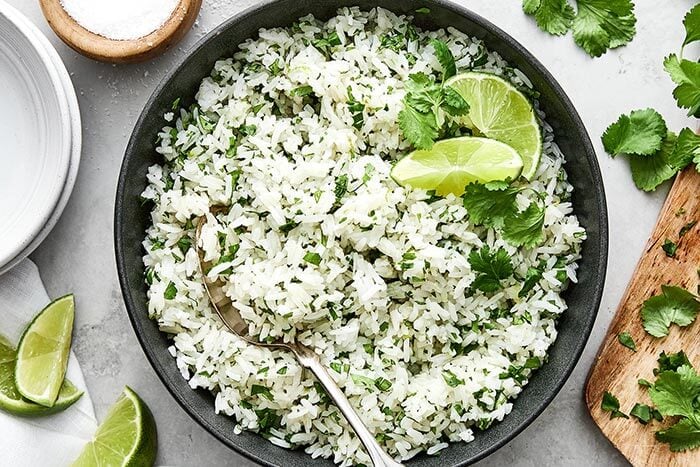 Cilantro lime rice in a bowl with spoon.