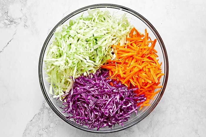 Shredded coleslaw in a bowl.