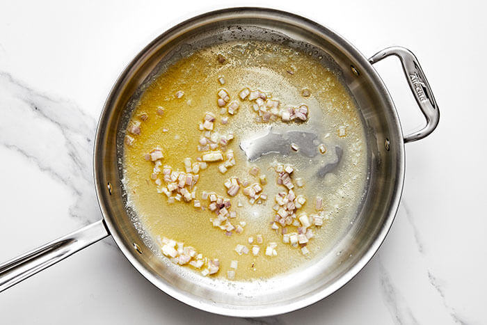 Shallots in a pan.