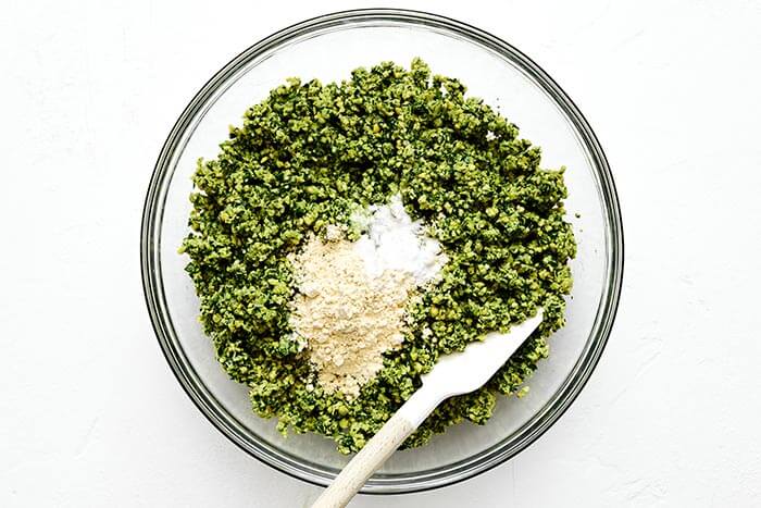 Mixing falafel ingredients in a bowl.