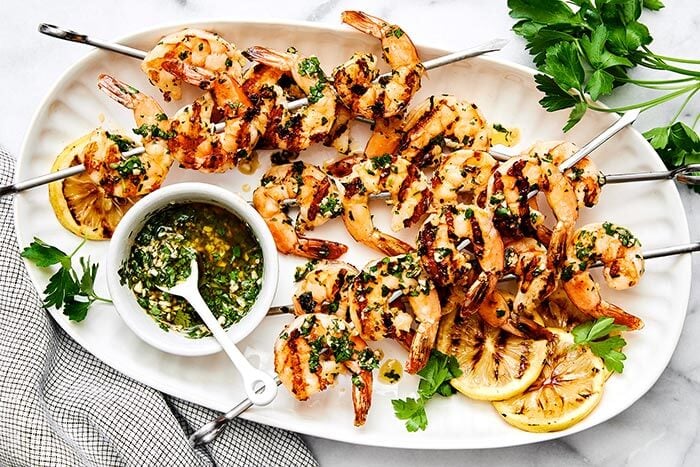 A plate of garlic grilled shrimp skewers.