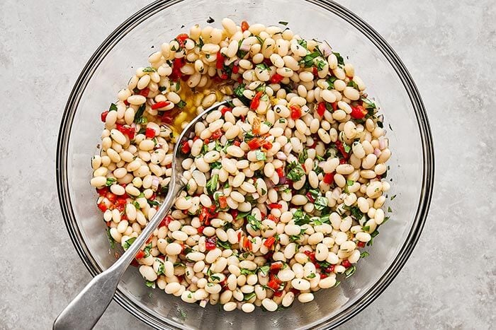 Marinated white beans in a bowl.