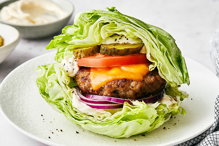 Turkey burger wrapped in lettuce.