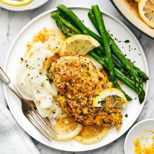 Lemon pepper chicken with mashed potatoes.