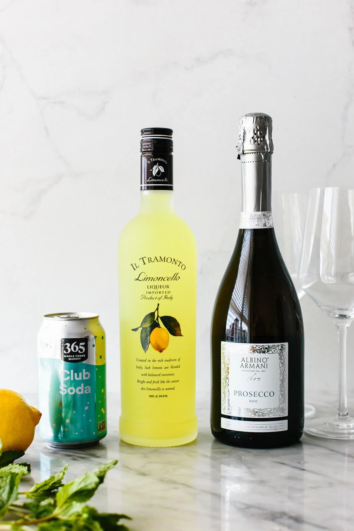 Ingredients for limoncello spritz on a table