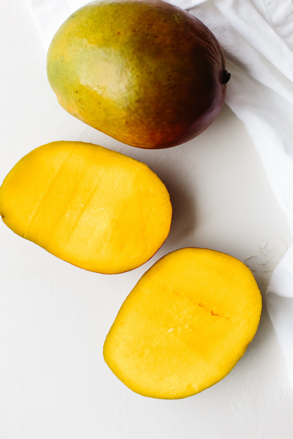 Mangos on a table for mango smoothie