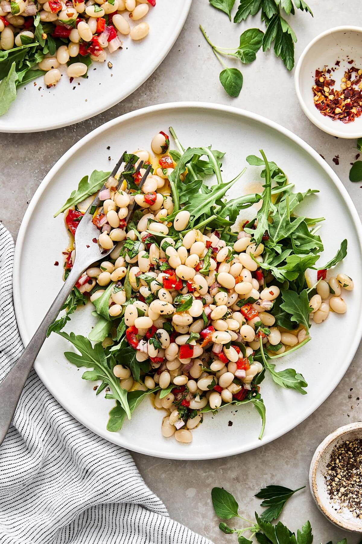 Marinated white beans on a salad.