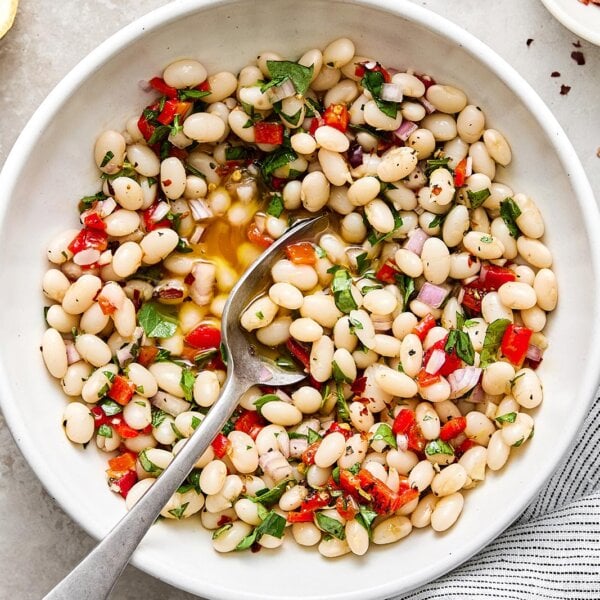 A bowl of marinated white beans.