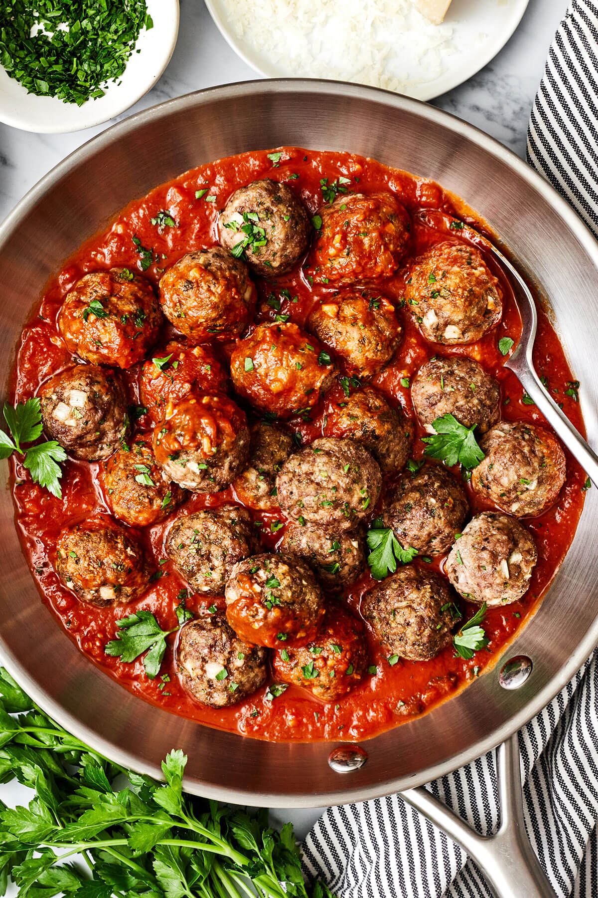 Baked meatballs in marinara sauce in a pan