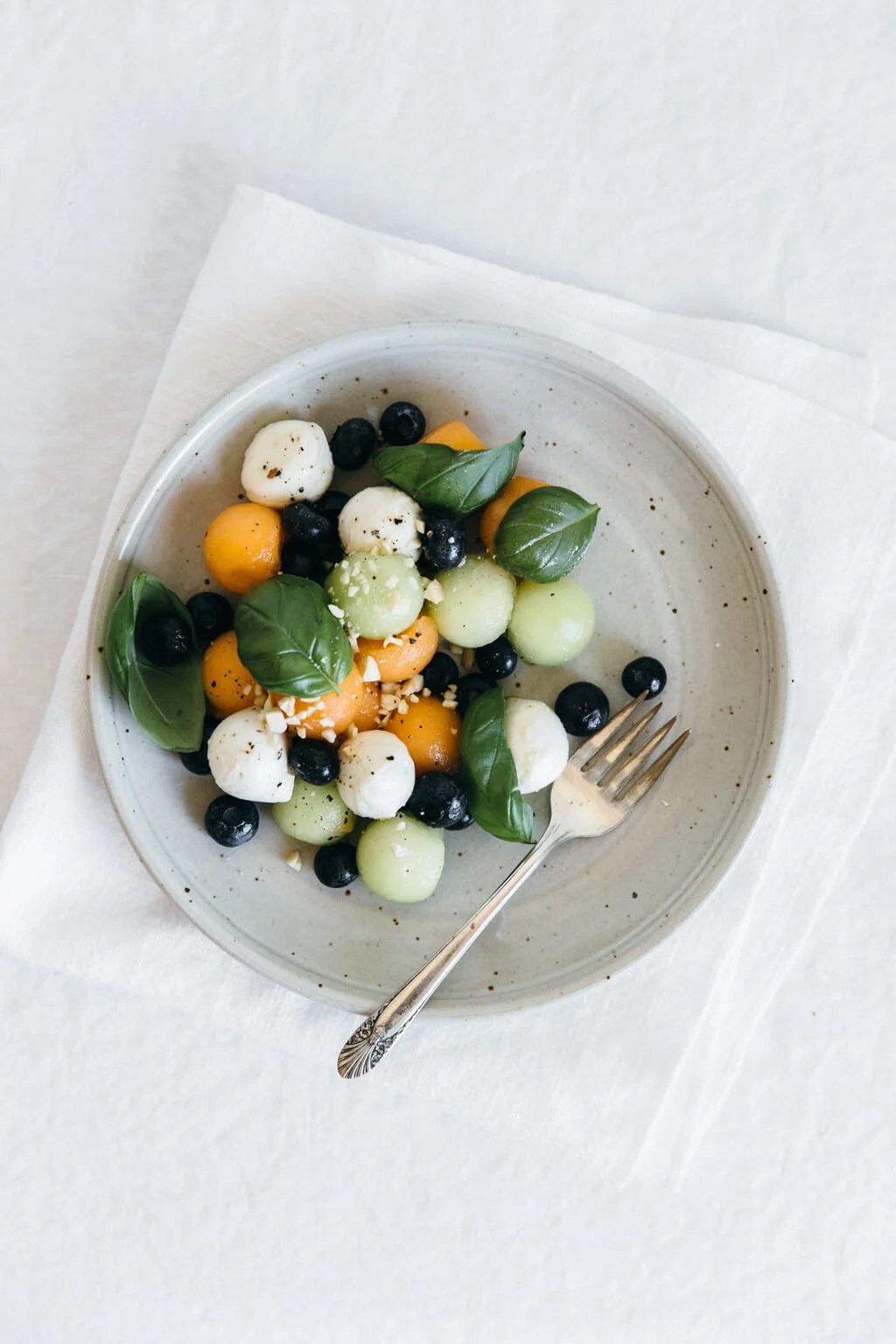 Melon mozzarella salad with basil. A delicious and healthy summer salad.