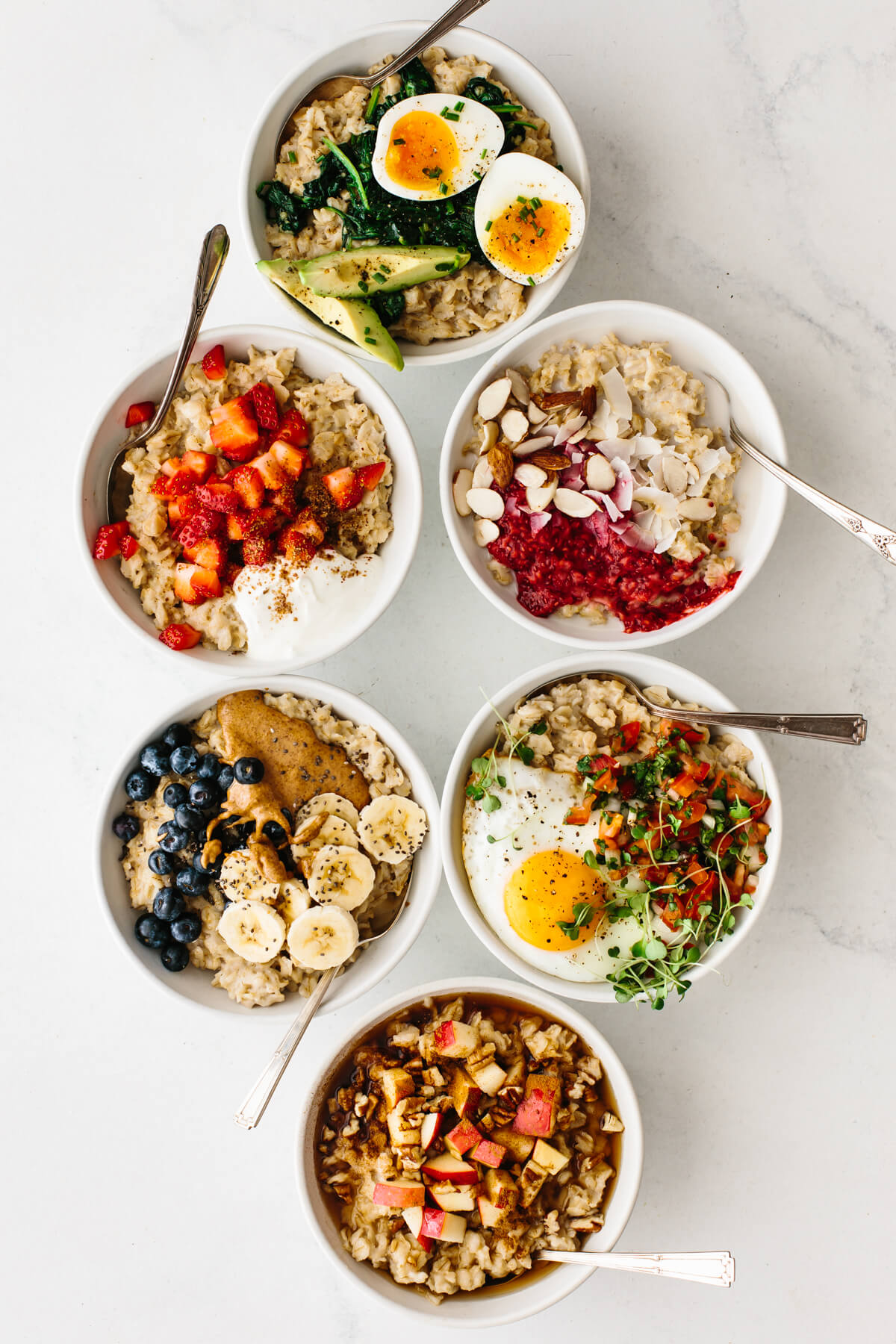 Bowls of oatmeal on a table.