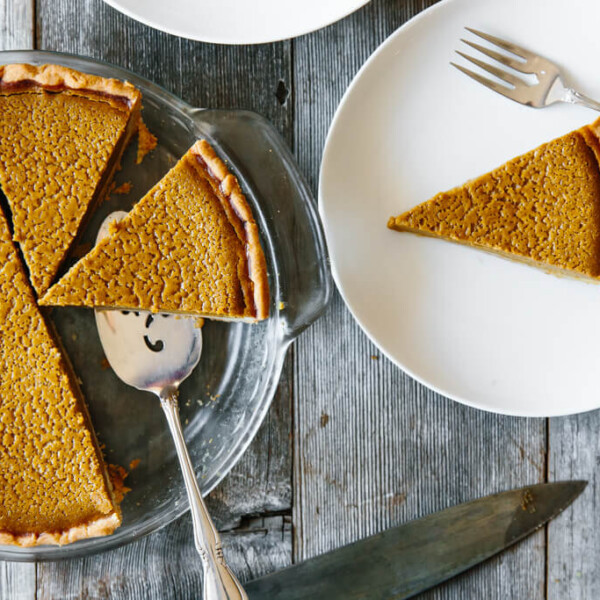 A slice of paleo pumpkin pie on a plate.