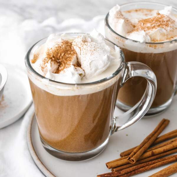 Mugs of pumpkin spice lattes on a table