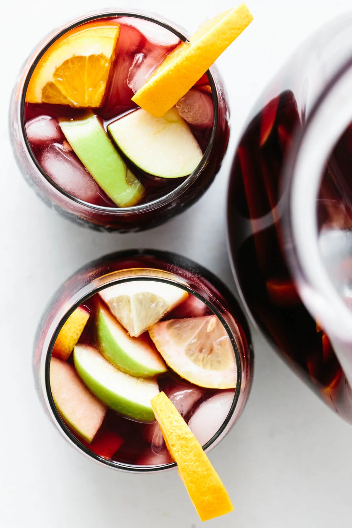 Top down view of two glasses of sangria.