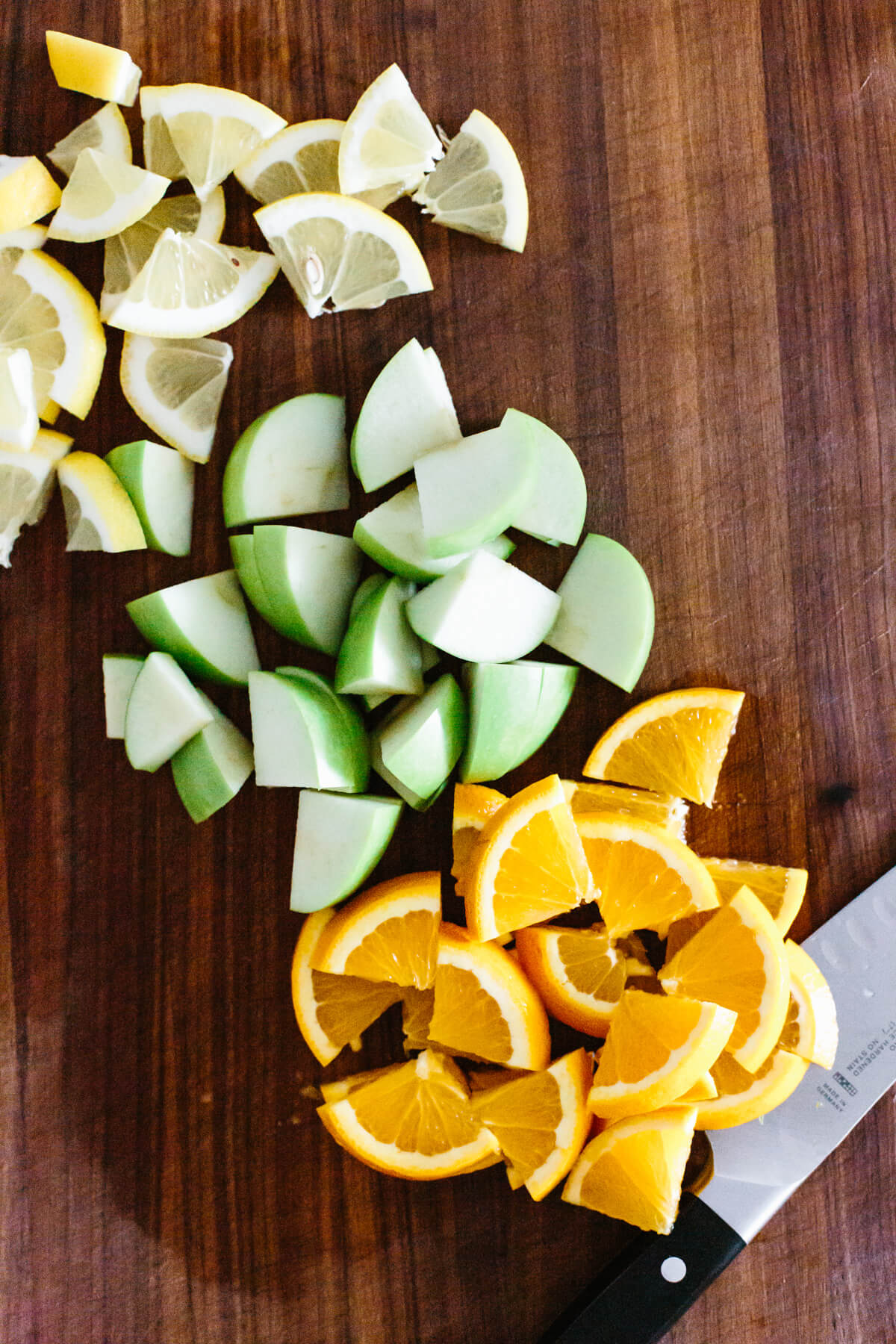 Chopping fruit for sangria.