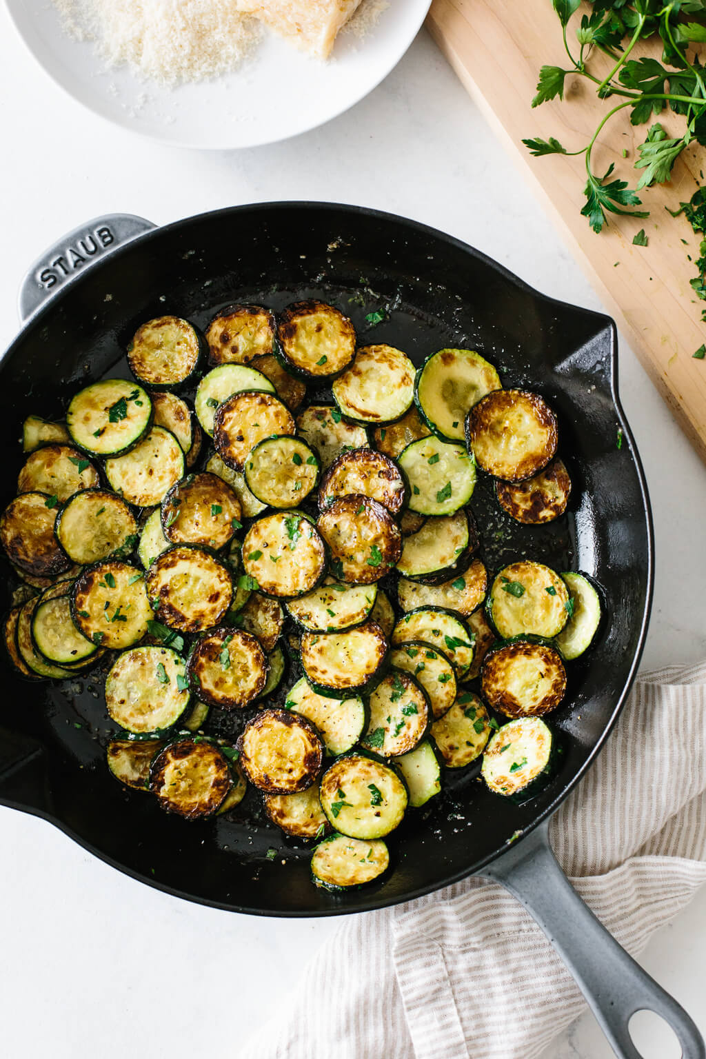 Sauteed zucchini in a pan.